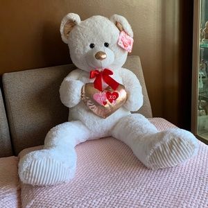 Big white/red Valentine’s Day bear holding a golden heart